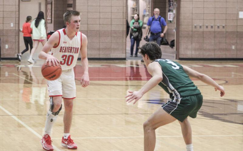 Beaverton’s Layk Woodruff runs the offense under Pinconning pressure Thursday night.