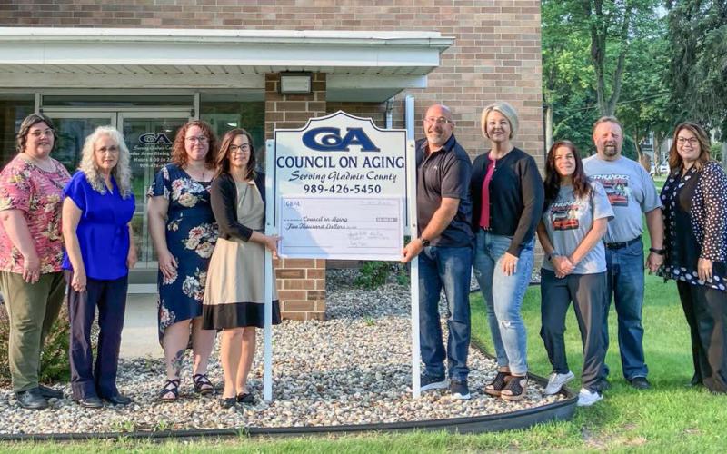 Pictured left to right: Angel Kraft, CoA Case Coordinator; Lori Stout, CoA Executive Director; Anna Mc-Neill, CoA Program Director; Jennifer Bullard, CoA Nutrition Director; Jason Schuster – Thunder on the Strip; Nanette Lytle – Thunder on the Strip; Karen Moore – Director of the GBPA and Thunder on the Strip; Mike Moore – Thunder on the Strip; and Stacy Plude, President of the GBPA.