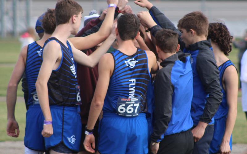 Gladwin Boys’ cross country participate in an end of meet celebration.