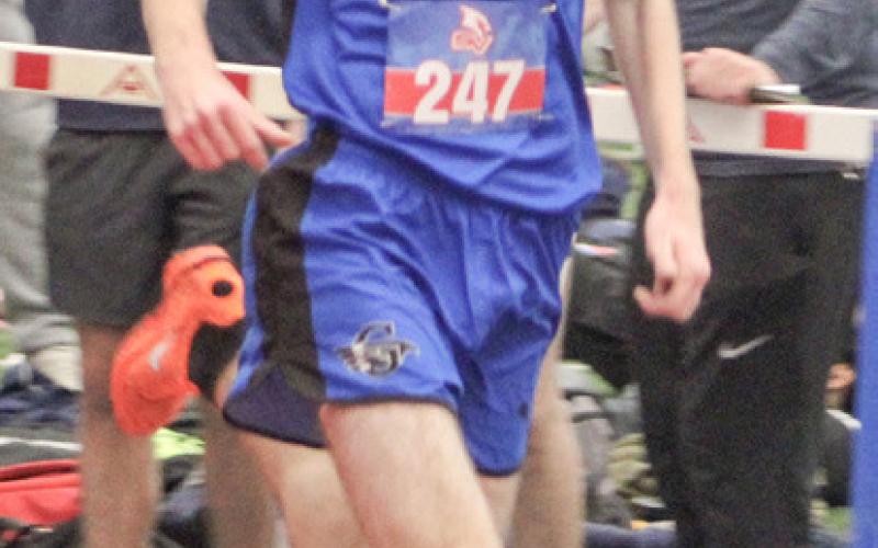 Abby Robinson set a Gladwin school record Friday at the Fowlerville Early Season Open by winning the 800 meters in a time of 2:22.19. Elijah Christensen (inset) led the boys’ team with a win in the 3,200.