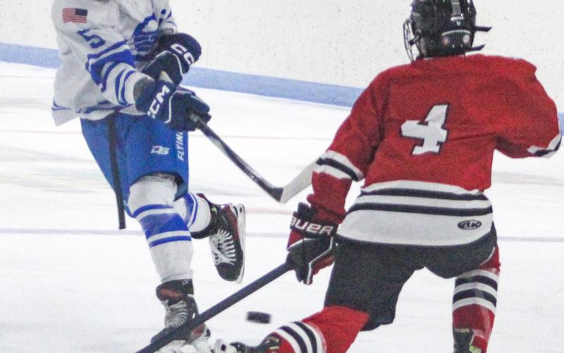 Gladwin’s Caden McKeever fires a shot past a defenseman for the FNV Griffins during the Flying G’s 4-2 victory last week.
