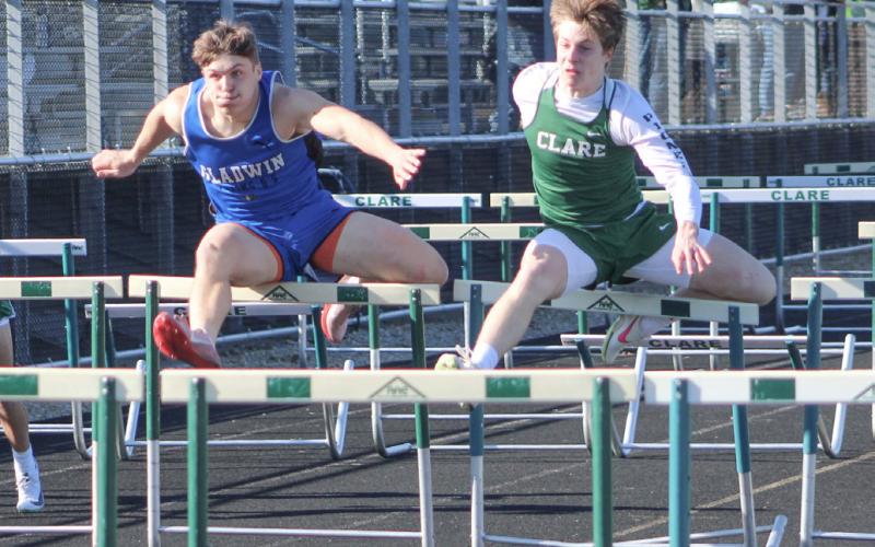 Gladwin’s Colton Pfenninger competes in the 110 hurdles last Wednesday at Clare.