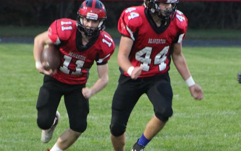 Beaverton junior varsity running back Caden Snyder follows blocker Ben Zdrojewski during a recent game. The Beavers finished the season with a comeback victory over Morley Stanwood.
