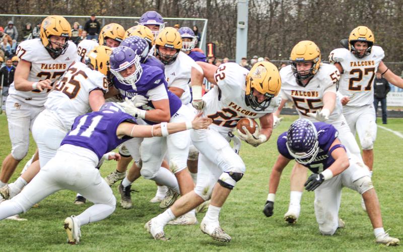 Ogemaw Heights’ Connor Lambert grinds out some tough yardage during Saturday’s victory at Saginaw Swan Valley that sent the Falcons into the Final Four in Division 5.