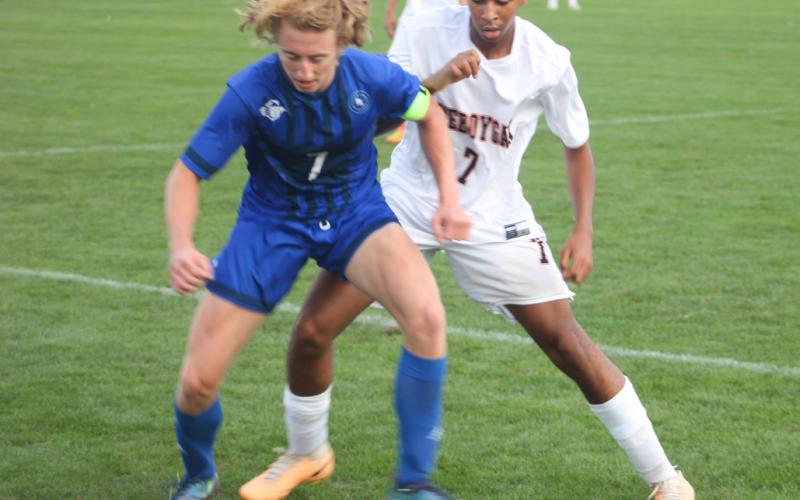 Gladwin’s Treyton Siegert battles for control of the ball during last Wednesday’s 6-2 victory over Cheboygan.
