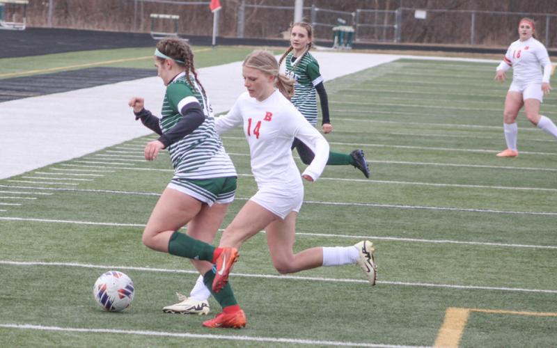 Beaverton’s Harlie Lamson battles for possession of the ball during last week’s season-opener at Clare.