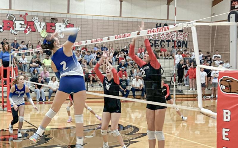 Beaverton’s Taryn Roberts (left) and Trinity Danielak defend the net during last week’s season-opener against visiting Beal City.