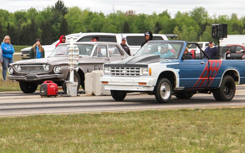 Racers put their pedal to the metal as they are signaled to start.