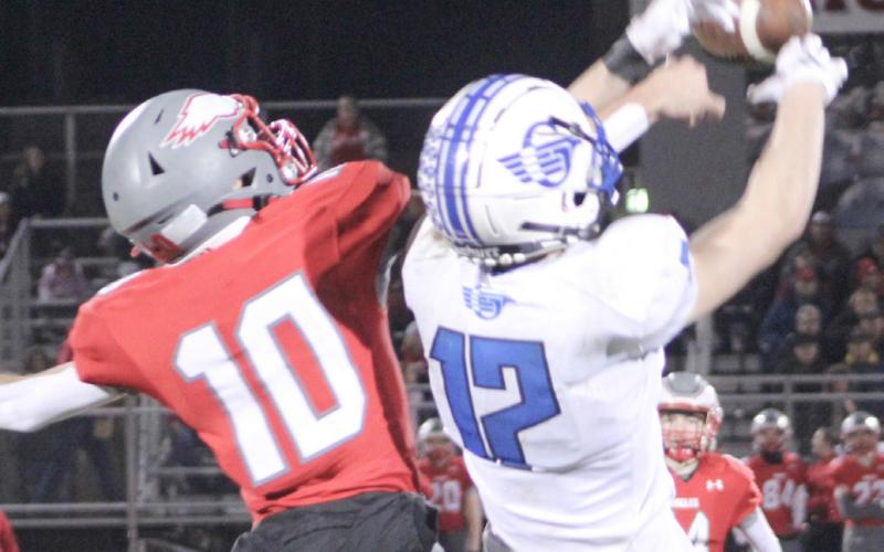 Frankenmuth’s Aiden Labissoniere knocks a pass out of the hands of Gladwin receiver Ike Wheeler.