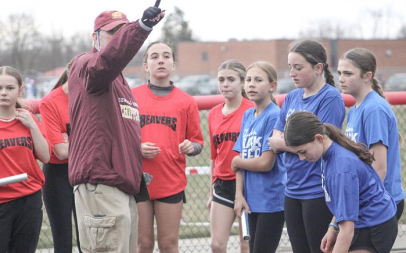 Relay teams from Gladwin and Beaverton get their instructions from the clerk prior to taking flight Friday.