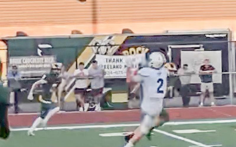 Gladwin’s MJ McDonald hauls in a touchdown pass Friday at Flat Rock, one of five trips into the end zone for the junior running back.