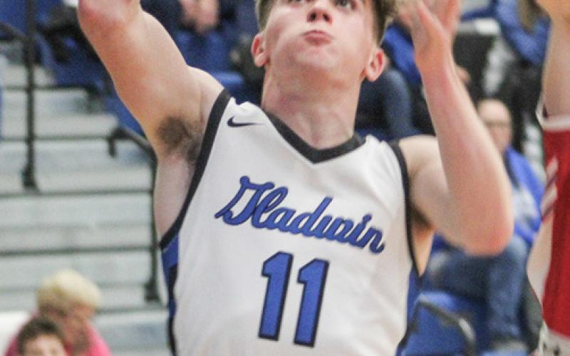 Gladwin’s Trace Corlew grabs a rebound during a recent game.