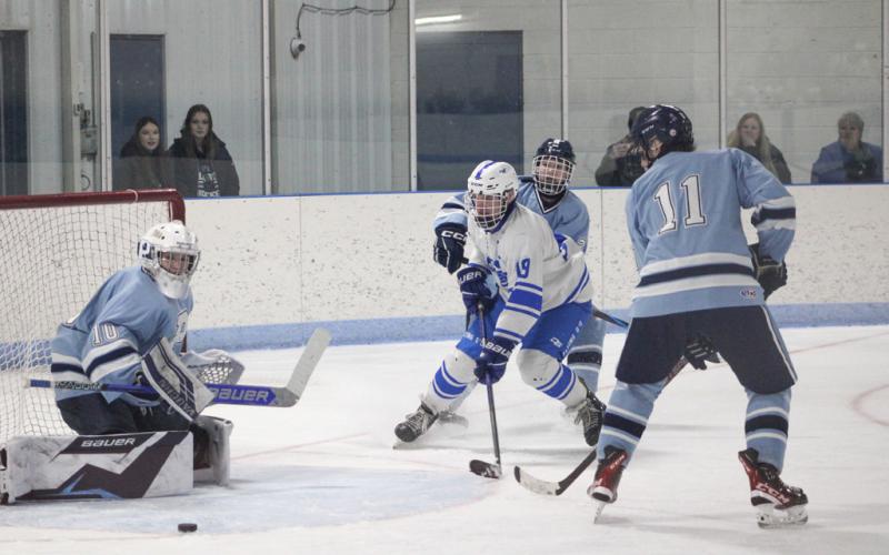 Gladwin’s Jeff Zeitz crashes the net looking for a rebound during Saturday’s loss to Petoskey.