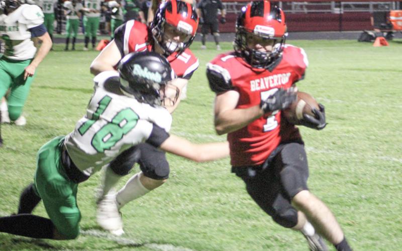 Beaverton’s Karter Offenbecker makes a cut up the field during Friday night’s victory over Houghton Lake.