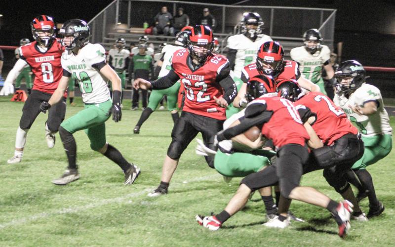 Beaverton’s defense meets at the quarterback for a sack during Friday night’s victory over visiting Houghton Lake in the final game of the season.