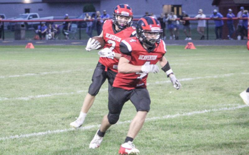 Jack Blades runs behind blocker Ty Wicke during a Beaverton junior varsity game earlier this season.