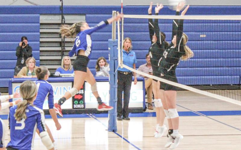 Gladwin’s Kamya Cajigas rips a kill through the defense during last Monday’s three-set victory over St. Louis.