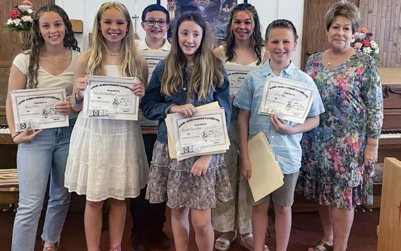 Pictured, left to right: Mary Miller, Talise Wohlschlegel, Reid Vannest, Brielle Graveline, Remy Allen, Koen Allen, and Sherrie Graham.