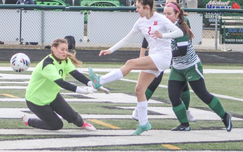 Emily Skotynsky shoots and scores the first goal of the season for the Beaverton soccer team, which debuted with a 2-2 tie at Clare last week.