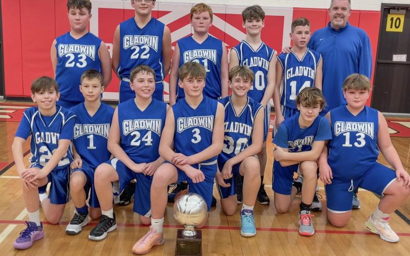 Pictured in back row, left to right: Rhylan Overton (23), Bentley Grice (22), Chris Van-Y (31), Remmy Hartley (10), Laine Hart (14), Coach Bryan Randle. Front row, left to right: Oakley Corradini (22), Cole Lockwood (1), Blake Verellen (24), Preston Newman (30), Keaton Mausolf (30), Tyler Mullins (21), and Bryce Mc-Cummings (13).
