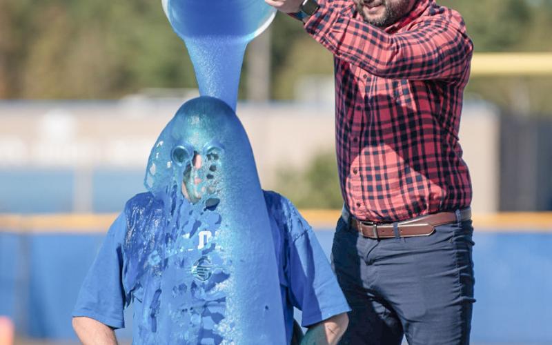 Principal Bryan Randle being slimed by fifth grade teacher Mr. Lake.