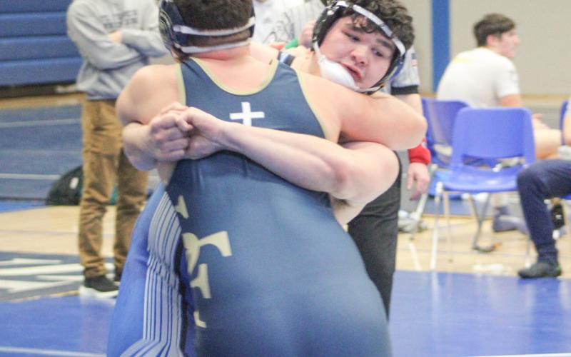 Heavyweight Nick Brasseur got a grip on five wins Saturday to help Gladwin win the Grayling Team Tournament.
