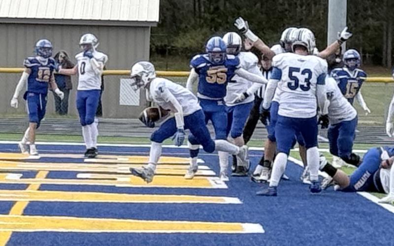 MJ McDonald bursts into the end zone for Gladwin’s only touchdown during Saturday’s loss at Kingsford in the first round of the Division 5 playoffs. PHOTO PROVIDED BY ALAN DONALDSON