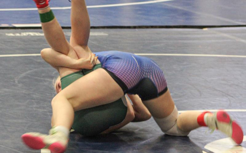 Gladwin’s Lily Miller scores another quick pin on her way to placing third at 125 at Friday’s tournament.