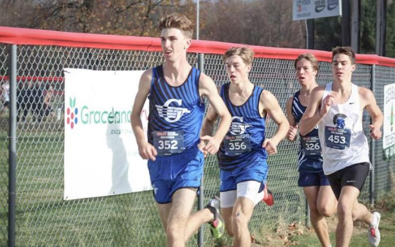 Gladwin’s Elijah Christensen won the regional championship and teammate Seth Mead was second Friday when the Flying G’s defended their title in the Divison 2 race at Benzie Central.