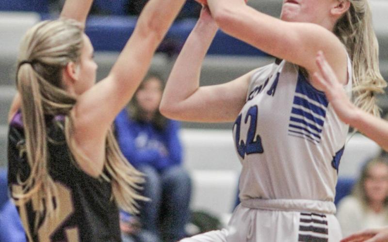 Lizzie Haines goes up with a shot during a game last season. The senior returns to the starting lineup for Gladwin this year.