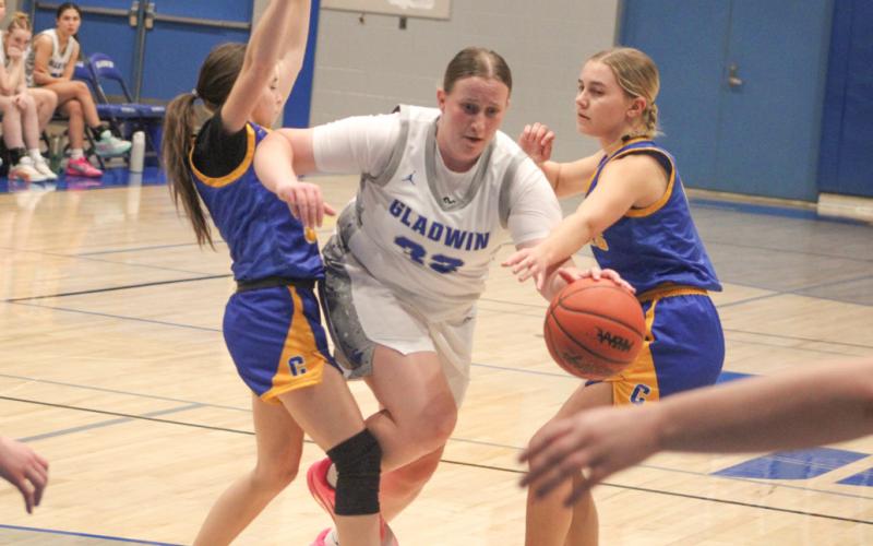 Gladwin’s Lela Gee powers through the defense during last week’s victory over visiting Carson City Crystal.