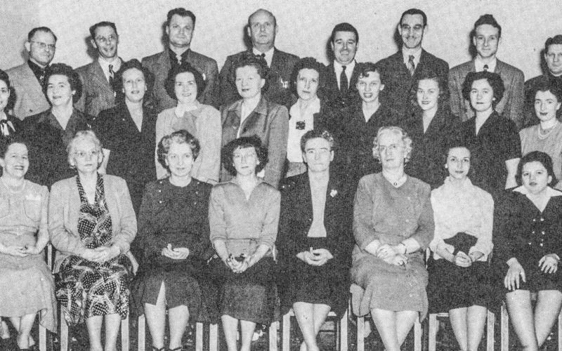 Pictured in bottom row: Harriet Martin, Flossie Cady, Mary Stockton, Helen Woodby, Minnie Schrader, Sadie Bergman, Margaret Newell, Margaret Lankin. Second row: Marie Crosby, Blanche Strouse, Vera Wagar, Mary Keough, Jean Singer, Virginia Ross, Paula Schumacher, Jean Wilson, Donna Grisdale, Cecille Farling. Third row: Fred Woodby, Rex Stockton, Edward Wodek, Paul Madison, Clarence Metzger, Harold Broka, Guerdon Schumacher, Leon Methner.