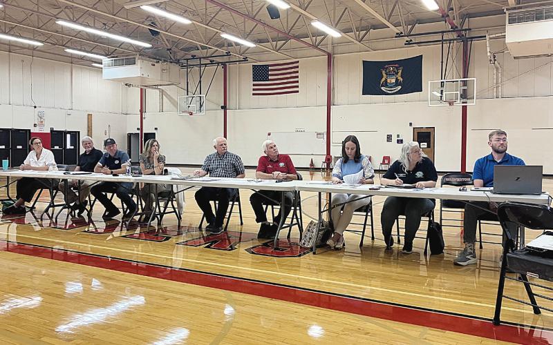 The Ross Lake Improvement Board presides over a meeting considering special assessments for weed remediation with residents and property owners Thursday at Beaverton Elementary School.