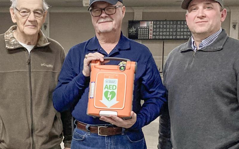 Pictured from left to right are Knights of Columbus (KofC) Grand Knight David Cooper, David Poxon, and Matt Fruchey. David Poxon generously funded the purchase of a new portable defibrillator for the Knights of Columbus as a memorial to his deceased wife, Janet Poxon. Matt Fruchey, an Emergency Medical Technician working for MyMichigan, demonstrated the unit to 20 Knights of Columbus members. “Thanks to David Poxon and Matt Fruchey for making us safer,” said Cooper.