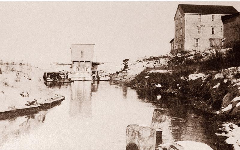 Gladwin Flour Mill and dam on the Cedar River. FROM A MONOCHROME PHOTO OF AN ORIGINAL IMAGE TAKEN BY JOHN RHODE CIRCA 1990