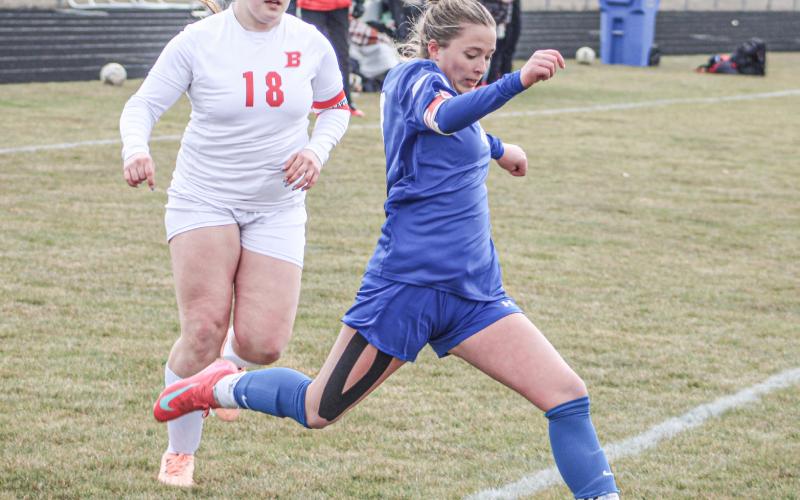 Gladwin’s Madisyn Lockwood gets ready to take a shot as Beaverton defender Sophia Milks closes in during last Ttuesday’s 3-1 victory for the Flying G’s.