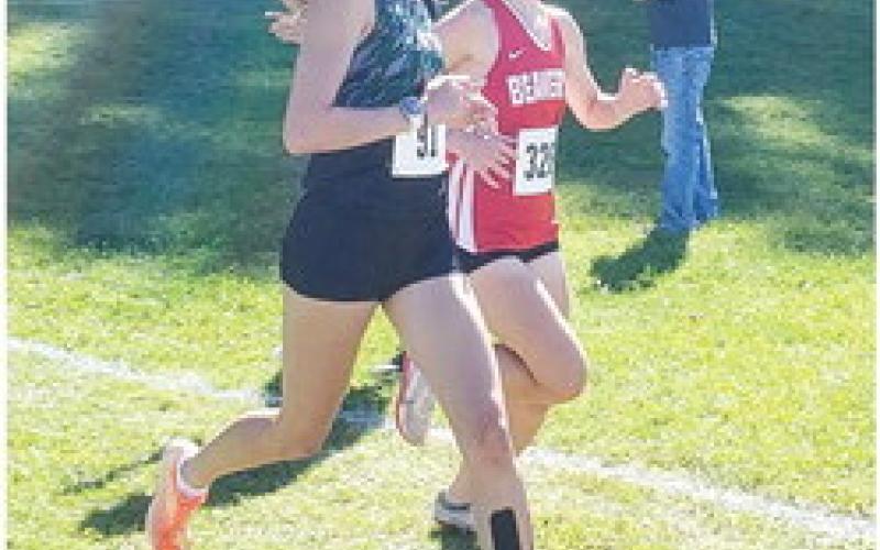 Tessa Wohlschlegel running at the Dwayne Rau Memorial Invitational. PHOTO PROVIDED BY PHIL EICHBAUER.