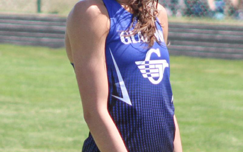 Gladwin’s Ava Gary is all smiles after breaking the school record in the 300 hurdles Saturday.