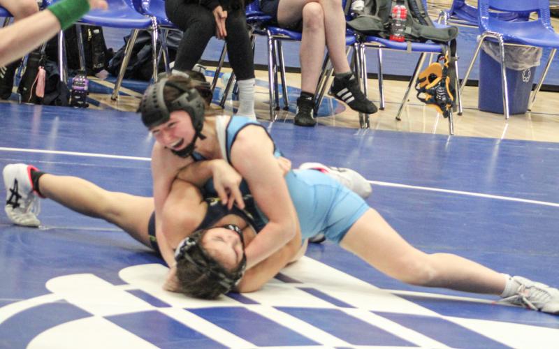 Gladwin’s Abby Thume enjoys a win at last Wednesday’s dual meet at 125 before going on to place second at Friday’s Manton Invitational.