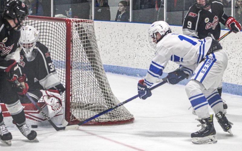 Gladwin’s Jacob Zeitz tries to stuff one in during a victory over the FNV Griffins earlier this season.