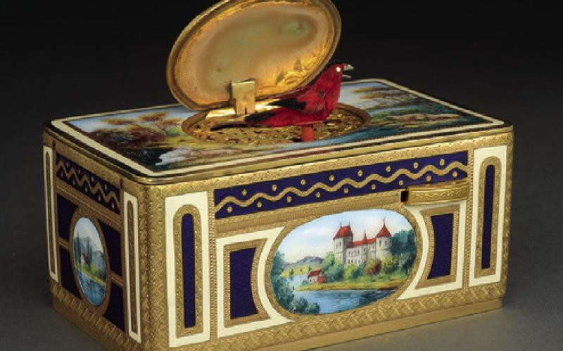 Is it a music box, a toy, a showpiece or a robot? Wind it with a key, and a feathery bird pops out to chirp and flutter in a lifelike way. KOVELS.COM