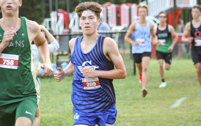 Gladwin’s Ben Verellen chases the leaders during a recent meet. The senior finished second Saturday at Northwood.