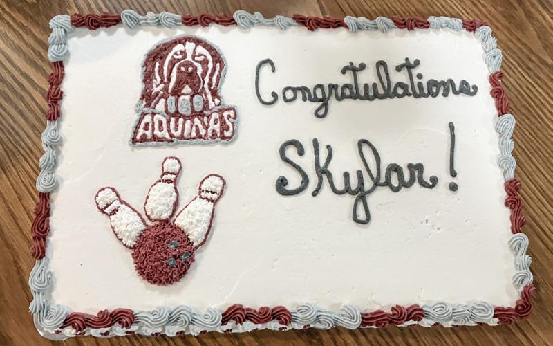 A large group of family and fans of Skylar Davy gathered Friday at Meadow Lanes to honor the Aquinas College recruit, who let them eat cake.