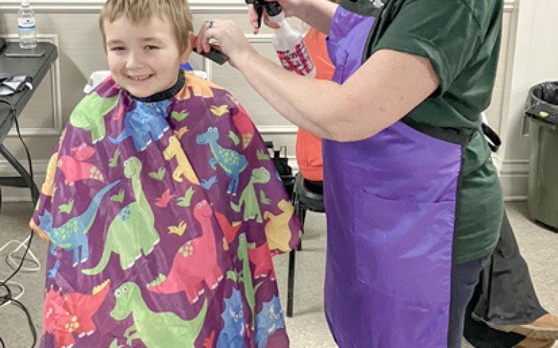 Winter Carnival passes out helpful info, haircuts and hats