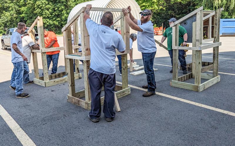 VOLUNTEERS BUILD COMMUNITY PANTRIES