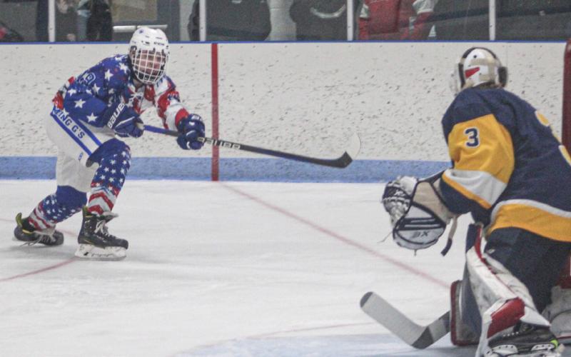 Gladwin’s Jeff Zeitz scores from a tough angle during Saturday’s mercy ruleshortened 10-2 victory over Grayling on Saturday.