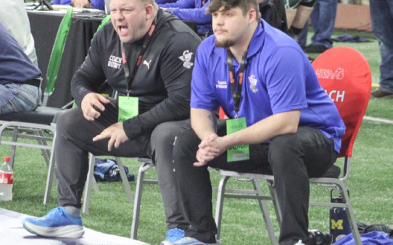 Gladwin sent 10 wrestlers to the main event Friday and Saturday at Ford Field and, with loud instruction from Coach Buddy Goldsworthy (inset), the Flying G’s brought home five All-State medals.
