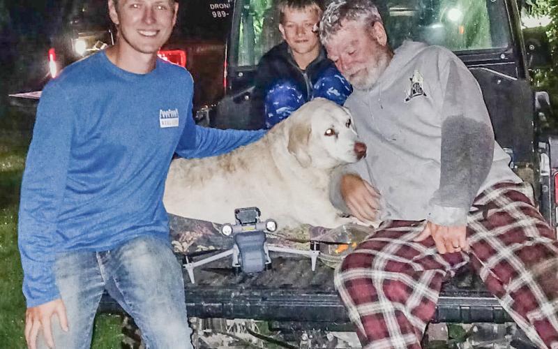Ryan Baker and Maddie’s whole gang were all smiles after the dog was located by his drone in a ditch in Pinconning last week.