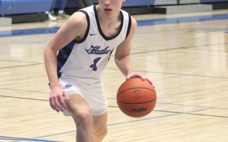 Gladwin’s Ben Verellen dribbles into the paint.