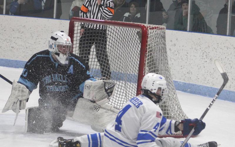 Gladwin’s Ike Wheeler takes a seat after being stopped by the Tri-Valley Thunder’s goalie Friday night.